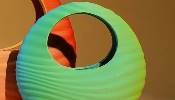 Prints display soft two-color shifts from different angles, offering strong visual depth
