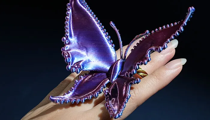 Silk-like texture with strong gloss, showing soft four-color shifts from different angles, smooth and refined appearance